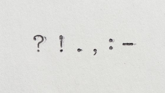 Punctuation marks of a question mark, explanation mark, full stop, comma, semi colon, and hyphen.