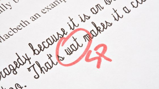 A picture of handwritten work, possible from a child in an English exam with corrections.