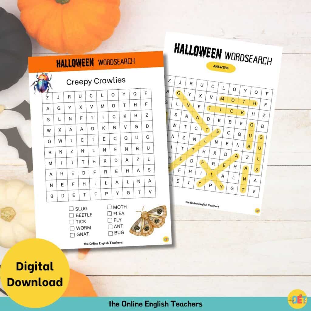 Image shows a flat lay halloween decorated table with a children's halloween wordsearch on top about creepy crawlies.