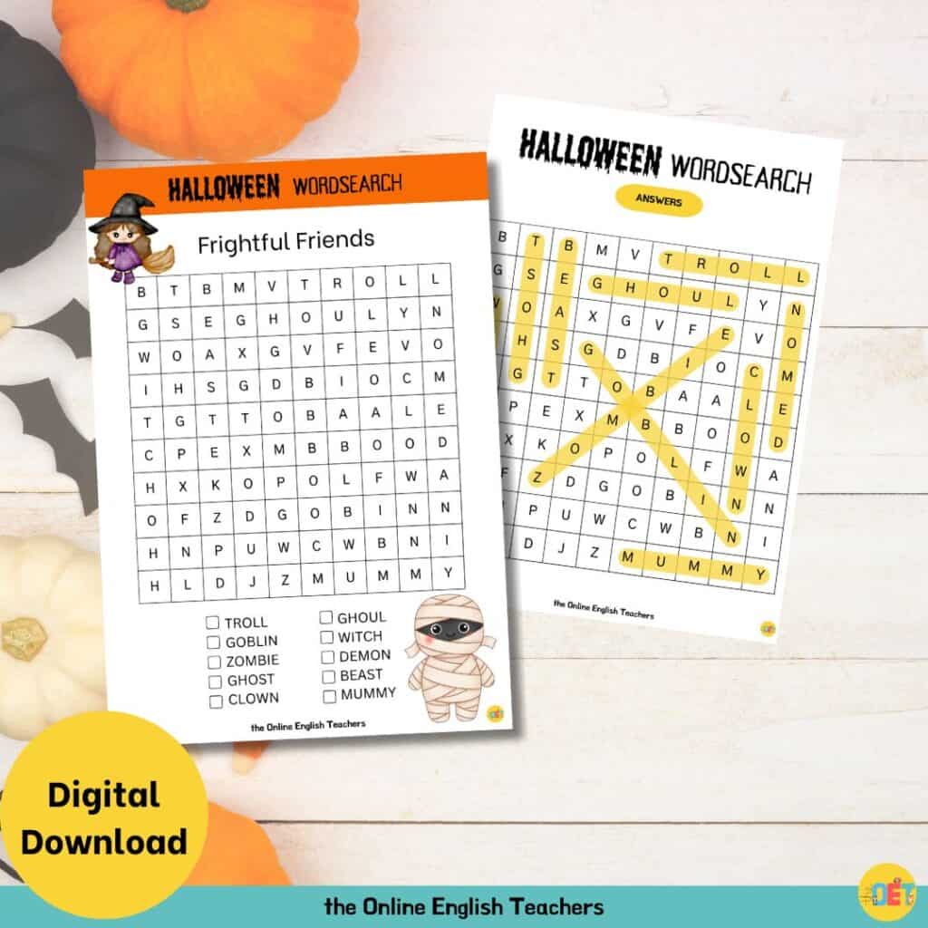 Image shows a flat lay halloween decorated table with a children's halloween wordsearch on top about frightful friends e.g. witch, mummy, or zombie.