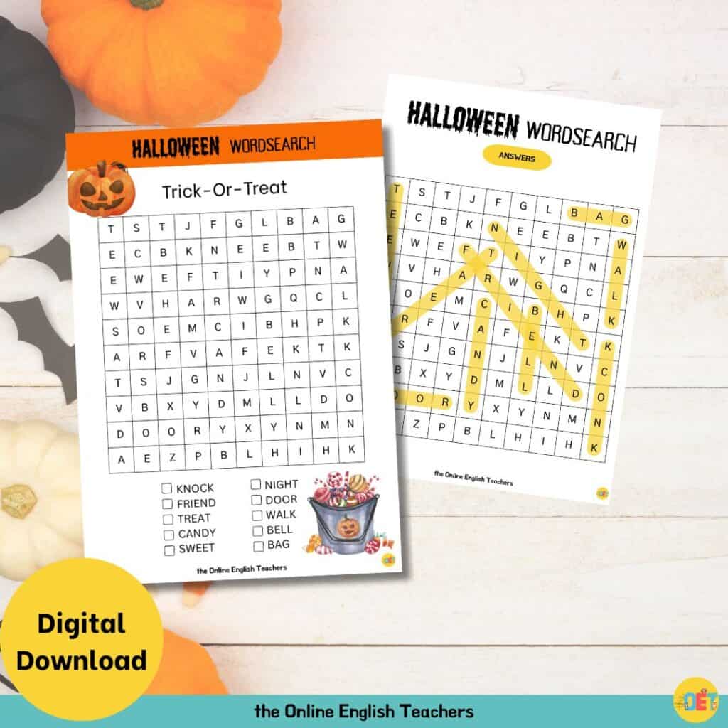 Image shows a flat lay halloween decorated table with a children's halloween wordsearch on top about trick or treating.