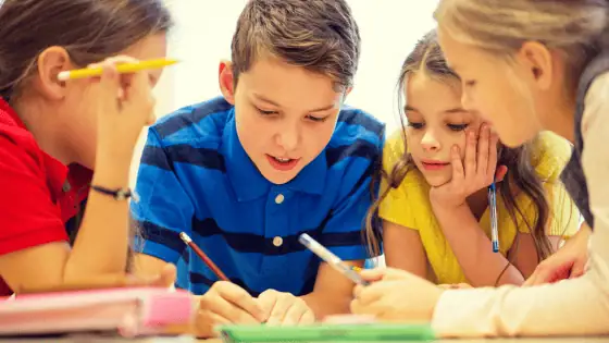 four children sat together studying